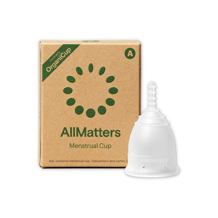 AllMatters silicone menstrual cup in Size A with plastic free packaging on left.
