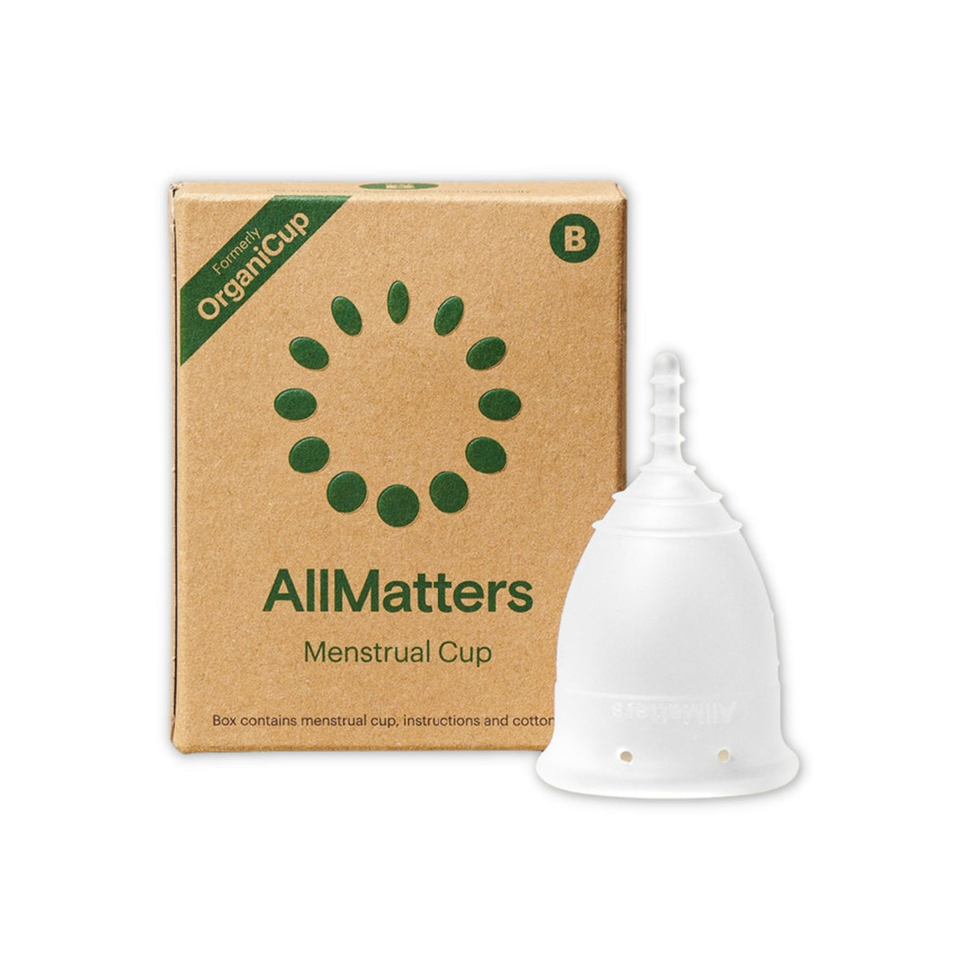 AllMatters silicone menstrual cup in Size B with plastic free packaging on left.