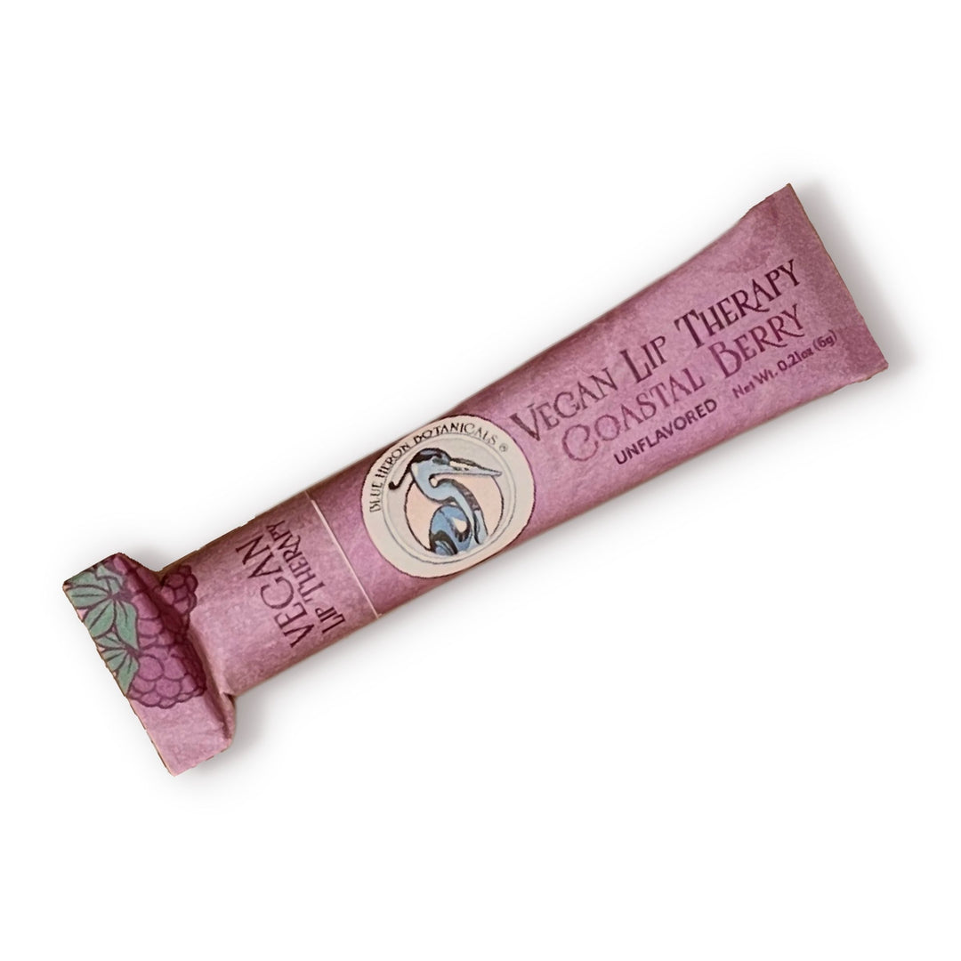Blue Heron Botanical Lip Therapy Balms in Coastal Berry formula (unflavored), packaged in pink compostable paper tube.