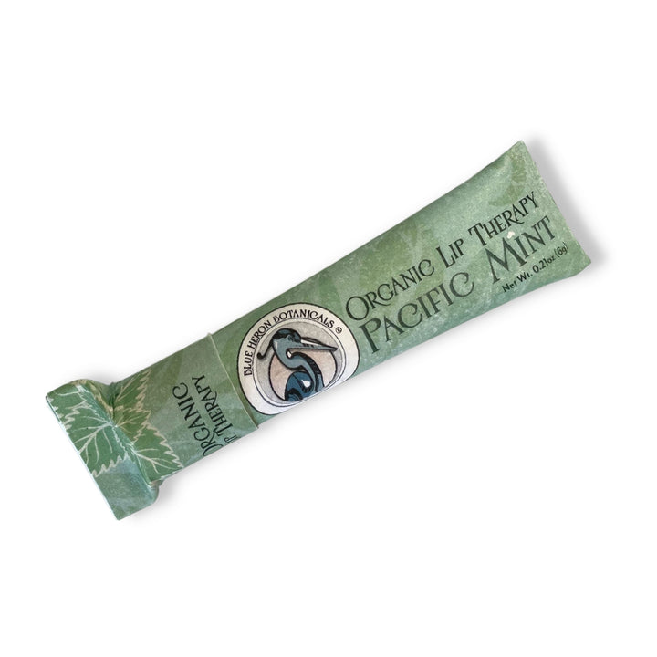 Blue Heron Botanical Lip Therapy Balms in Pacific Mint formula, packaged in green compostable paper tube.