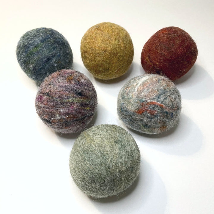 Bog Berry Wool Dryer Balls - Set of Six in Earthy Heathers, Shown on White Background.