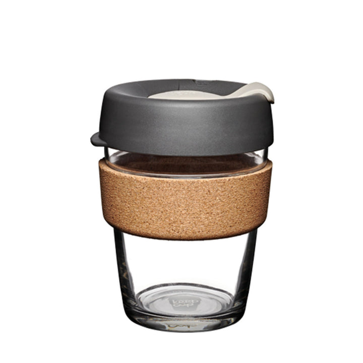 Tempered glass coffee cup with 100% recycled cork sleeve and charcoal colored lid.