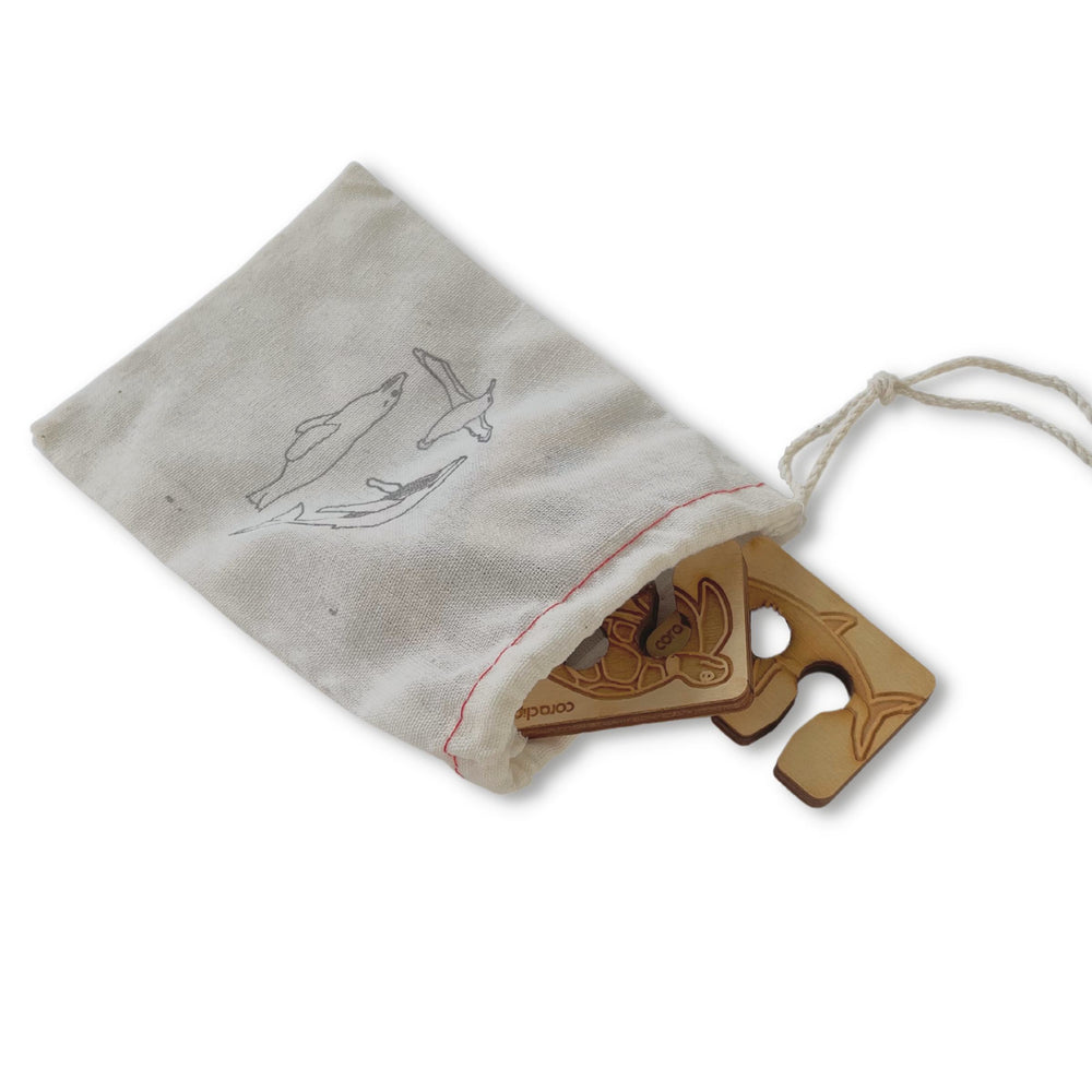 Wooden bag clips with cotton gift bag with marine life print. Shown here with 2 of 4 clips at bag opening on lower right with Sea Turtle and Shark desgins.