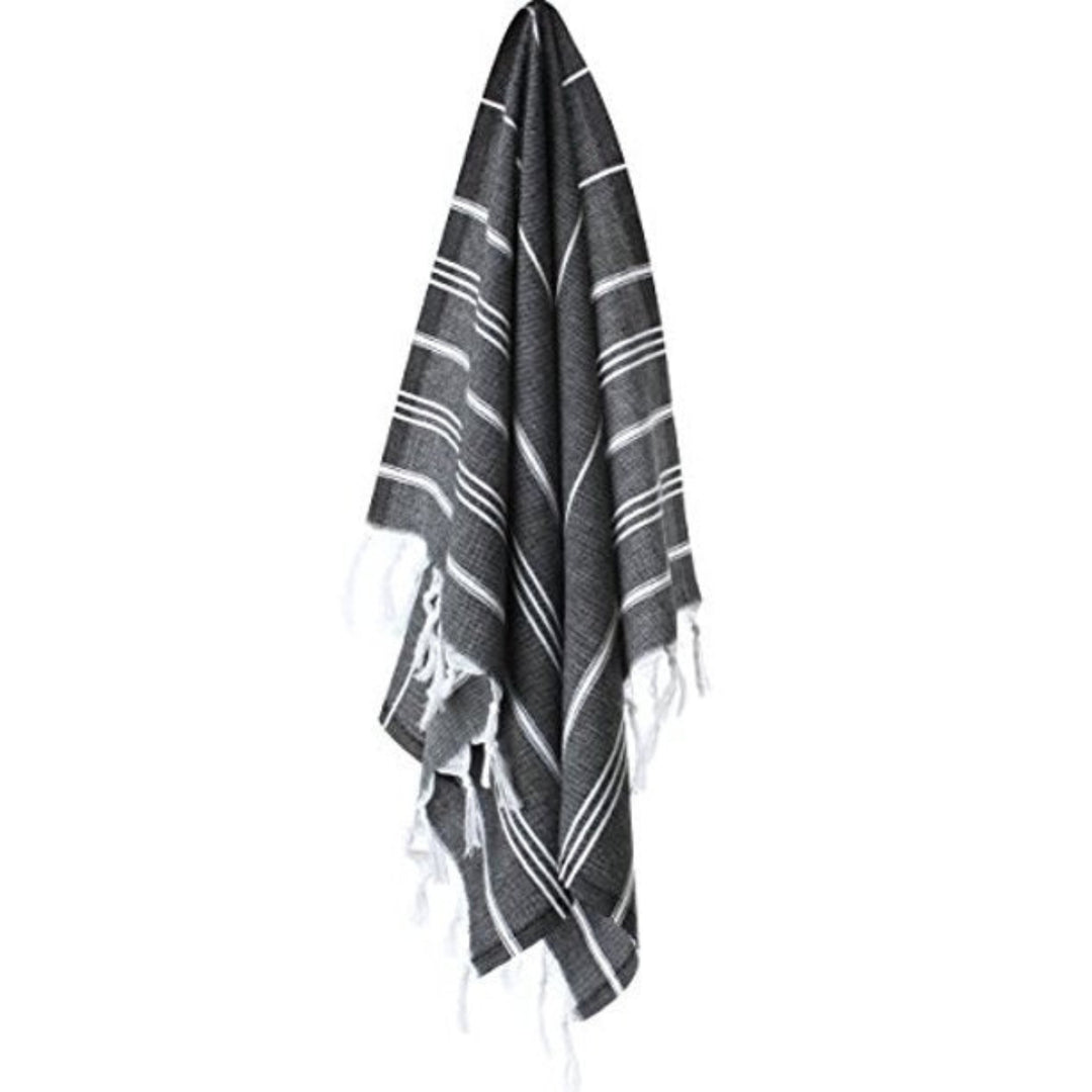 Upcycled Cotton Turkish Towel in stripe design, shown hanging from wall hook.