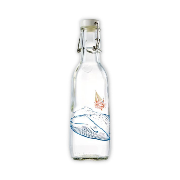 Love Bottle Clear glass bottle in Whale design featuring humpback whale and person in sailboat.