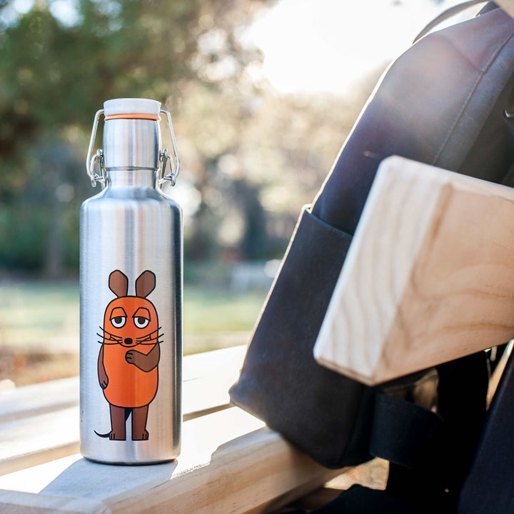 Soulbottles Insulated Stainless Steel Bottle - 20 Ounce in "The Adventure Mouse" Design. Set on wood bench with backpack.