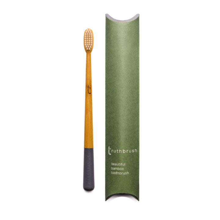 Bamboo Toothbrush for Adults with easy-to-identify Storm Gray handle with plastic-free tube package.