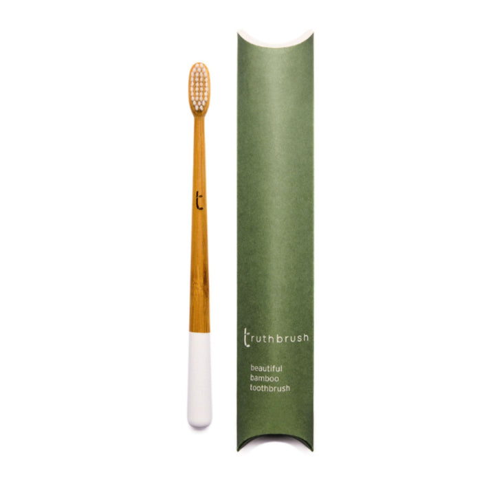 Bamboo Toothbrush for Adults shown in Cloud White color option with plastic-free tube package.
