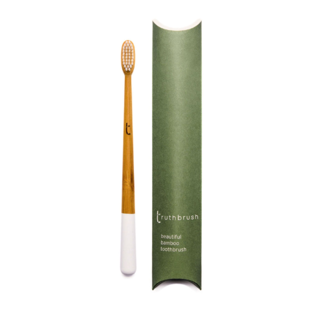 Bamboo Toothbrush for Adults shown in Cloud White color option with plastic-free tube package.