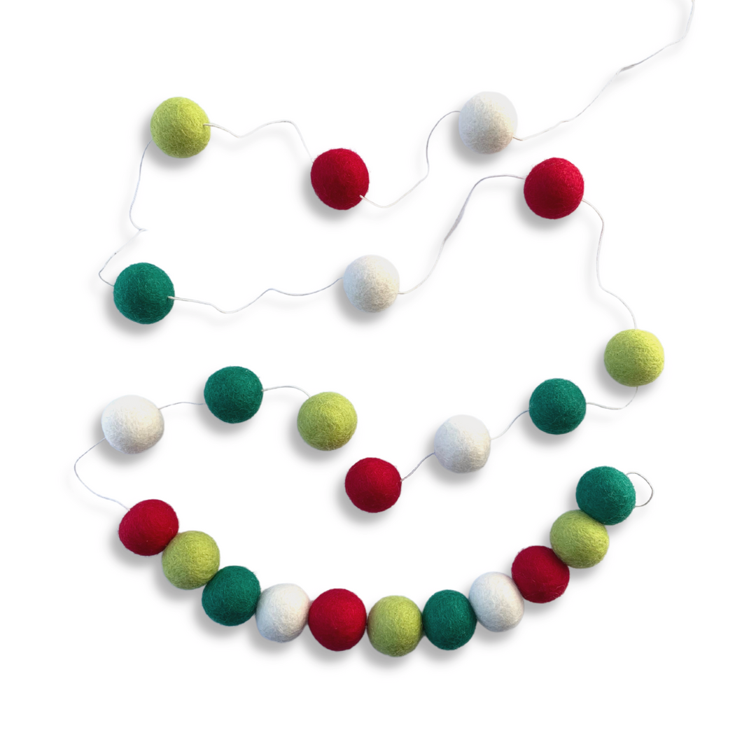 Friendsheep North Pole Eco Garland, in White, Red, Light Green, and Dark Green Colors. Shown with a Variety of Spacing of Felted Balls.