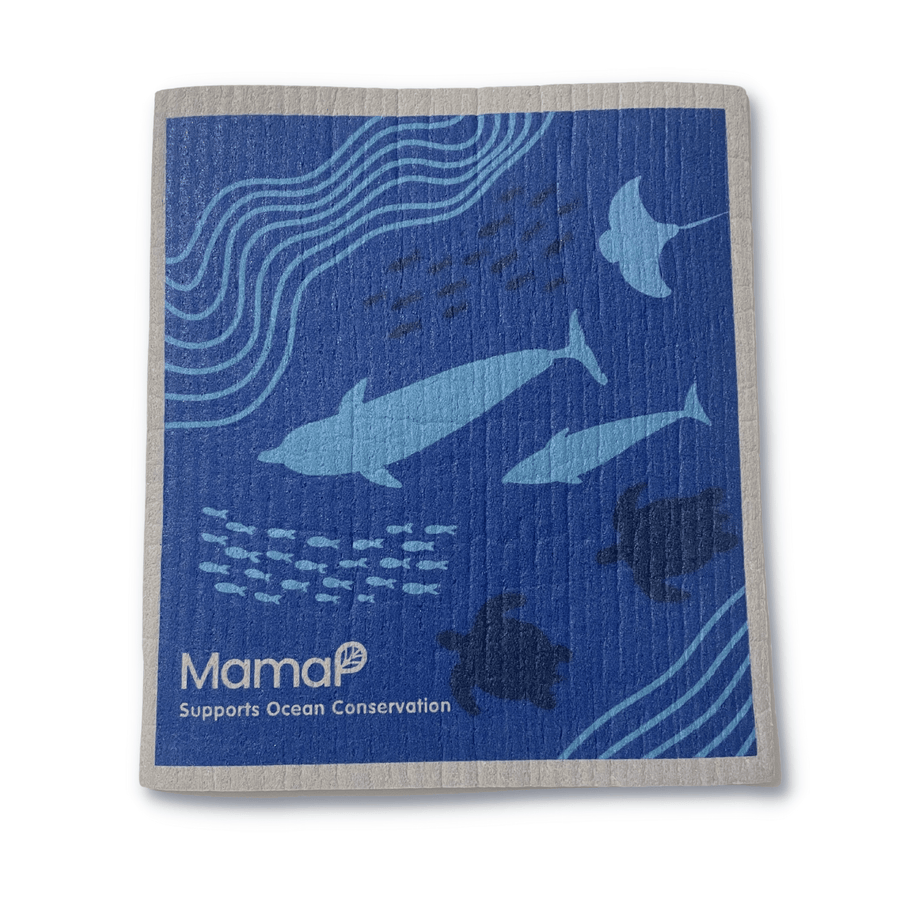 MamaP Swedish Dish Cloth Featuring Sea Life as Visual Reminder That They Support Ocean Conservation. In Royal Blue Background on Gray Cloth, with Dark Blue Sea Turtles  and Small Fish, and Light Blue Dolphin, Large and Small Fish, Stingray, and Waves.