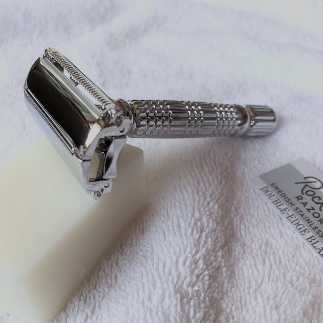 Rockwell Razor, Shown Resting On Shave Bar And Towel, With Blade In Packaging.